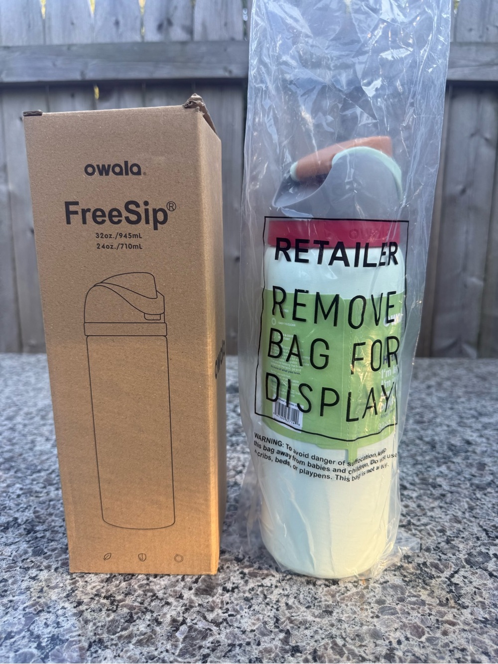 Owala FreeSip Mint Green Travel Bottle with Orange Accent Handle